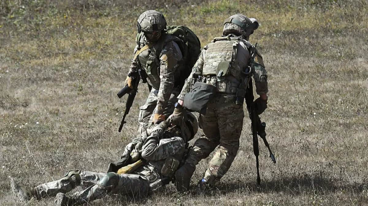 A wounded Russian soldier is carried during a military drill in Crimea, 13 September 2023. Source: Viktor Korotaev / Kommersant / Sipa USA / Vida Press